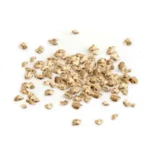 Dried root pieces scattered on white background.
